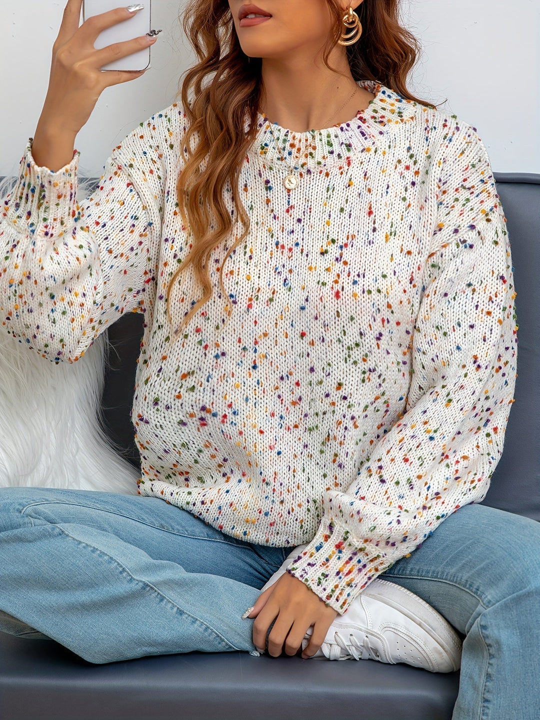 Women's cozy confetti print sweater with round neck, perfect for playful fall & winter fashion. Warm knitted pullover.