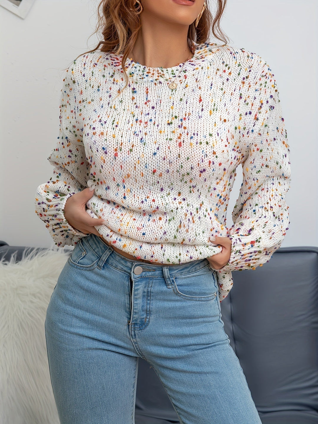 Playful women's knitted confetti print pullover, a cozy & warm round neck sweater for stylish fall and winter fashion.
