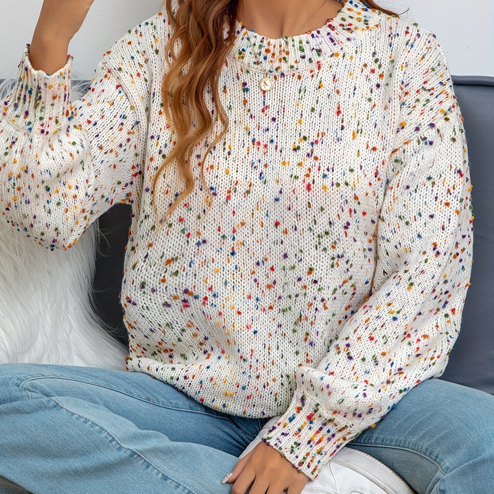 Warm & playful women's confetti print knitted sweater, offering cozy comfort. Stylish round neck pullover for fall fashion.