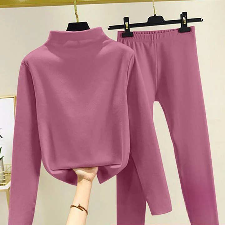 Soft fleece loungewear set for women, featuring a comfortable pullover and matching trousers for casual wear.