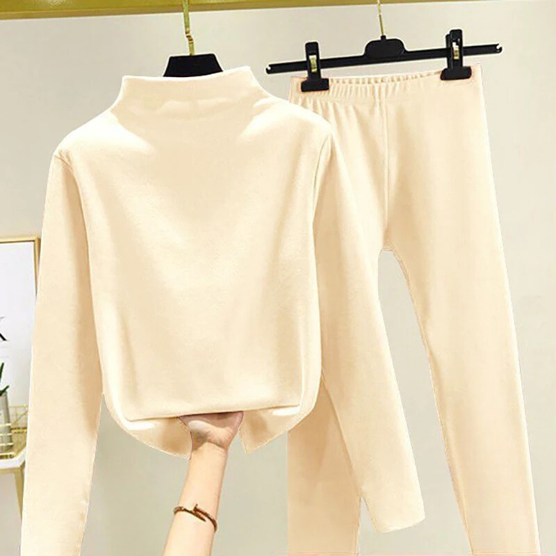 Stylish women's fleece set with a soft pullover and comfortable trousers, great for winter warmth and relaxation.