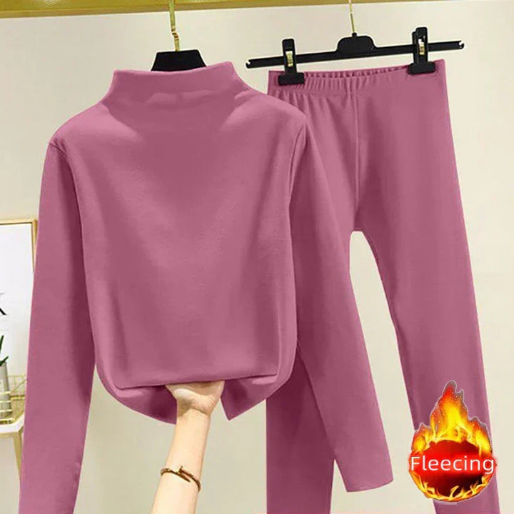 Two-piece women's winter set: cozy fleece pullover & matching trousers. Perfect for staying warm at home.