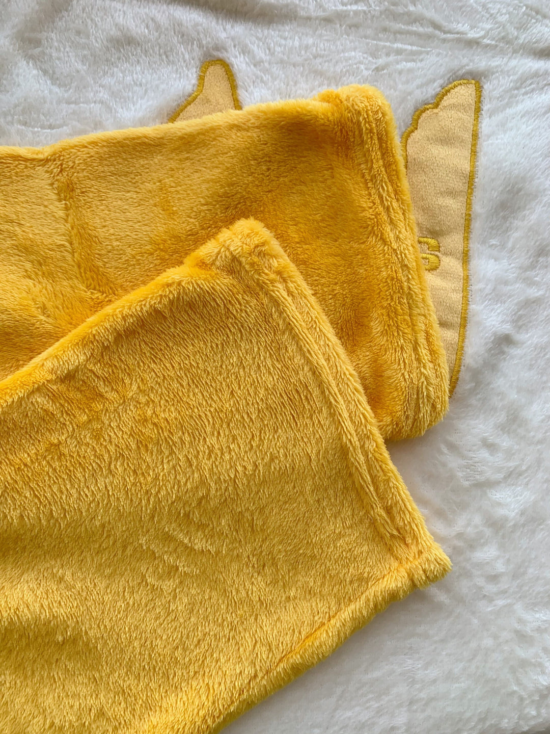 Warm women's pyjama set featuring cozy fleece fabric, delicate embroidery, and a round neck for winter comfort.