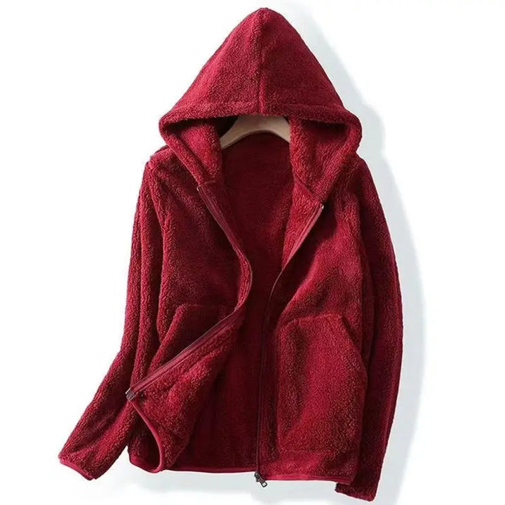 Close-up of the zipper and hood on the women's cozy khaki winter jacket, with soft texture.