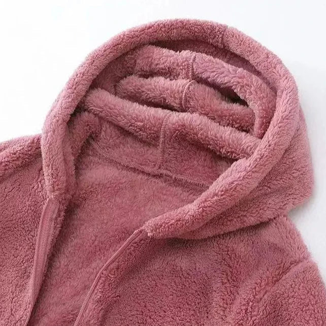 Women's red hooded zip-up jacket, showcasing the vibrant color and cozy winter outerwear design.