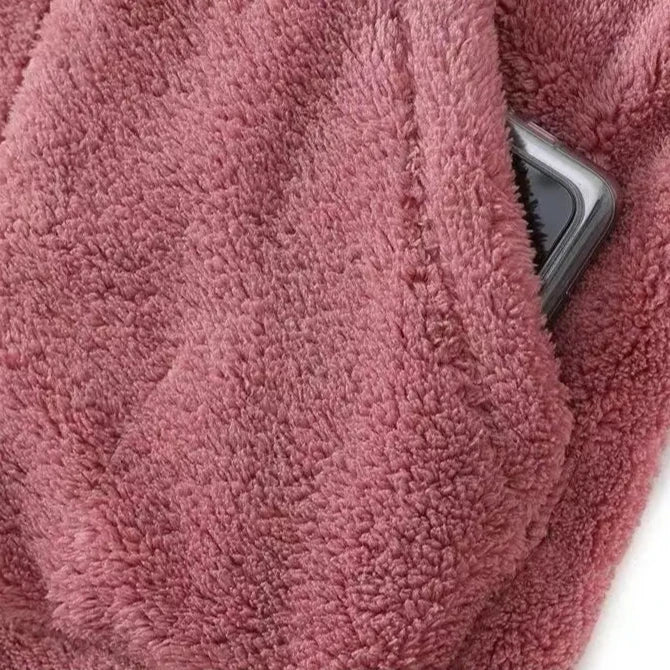 Detail of the soft inner lining of a women's hooded winter jacket, emphasizing warmth and comfort.