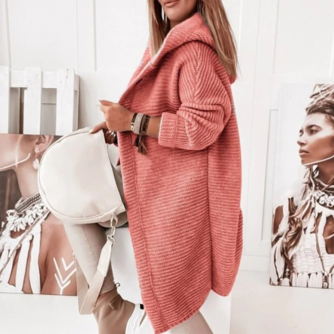 Women's hooded long sleeve knit cardigan, offering warmth and a relaxed fit for everyday wear.
