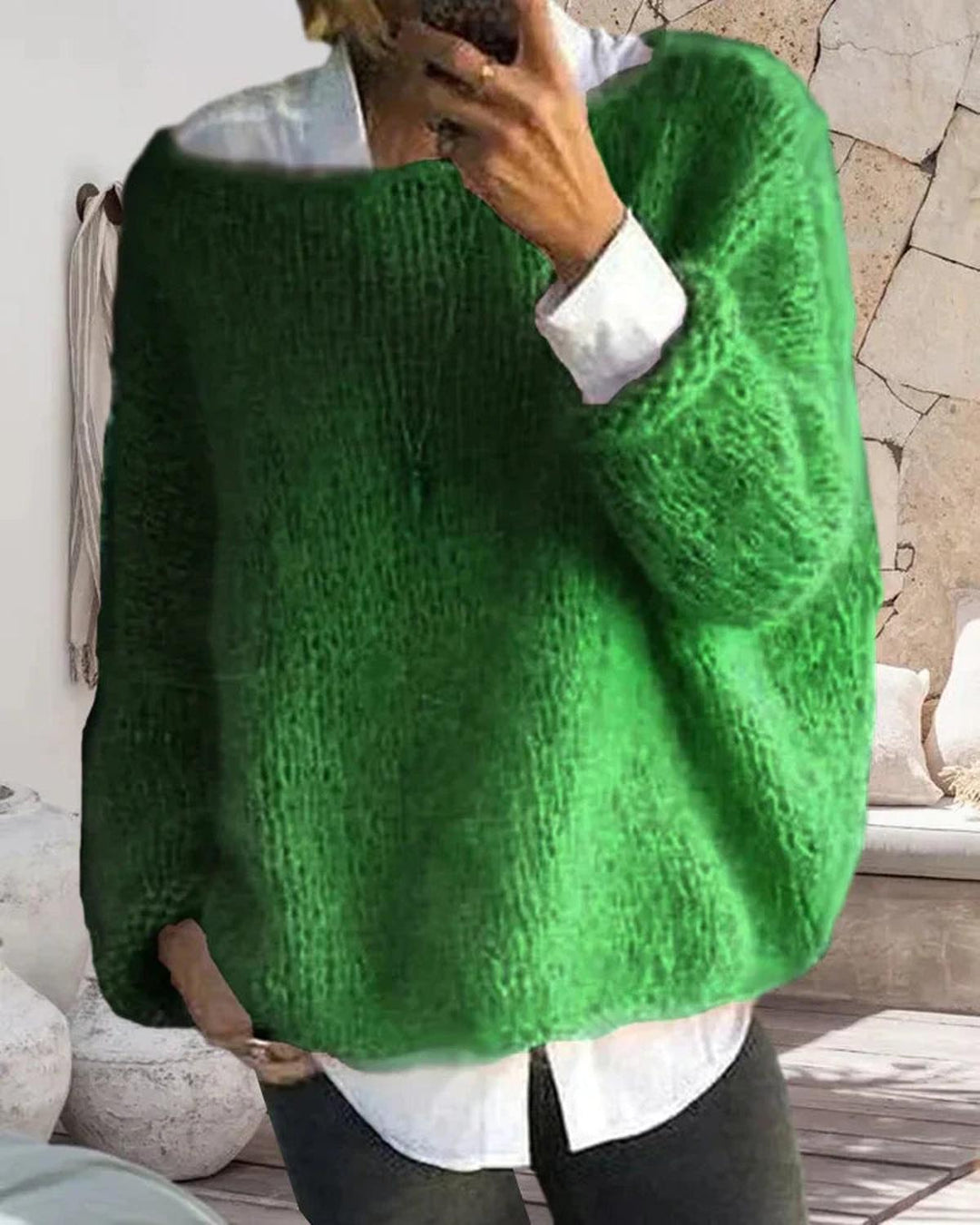 Back view of a women's soft knit long sleeve sweater, demonstrating the overall cozy design.