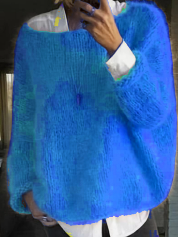 Soft knit fabric of a women's long sleeve sweater, emphasizing its comfortable and warm feel.