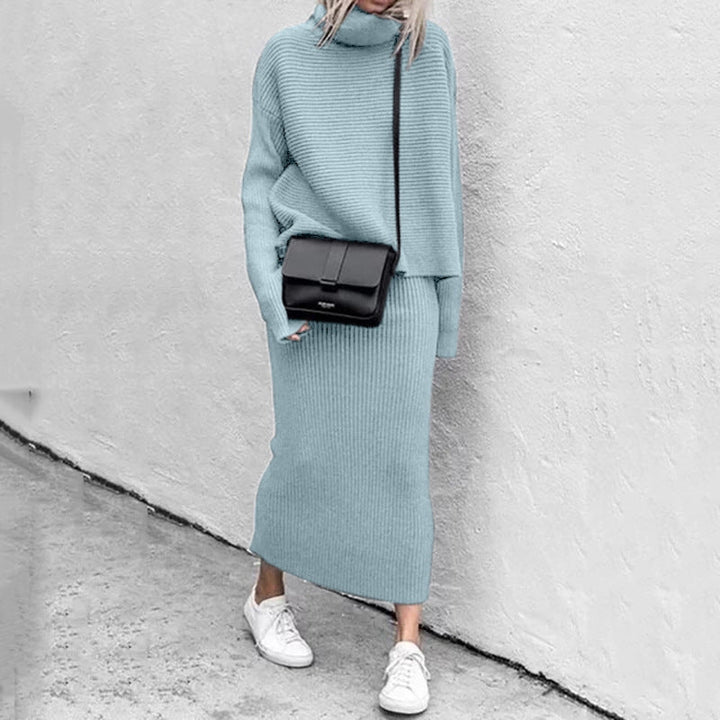 Matching women's knit pullover with long sleeves and a ribbed midi skirt, perfect for a coordinated look.