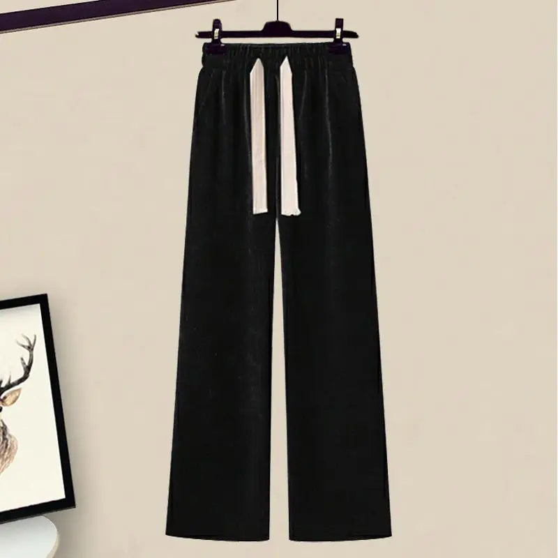 Stylish women's fall fashion: knit sweater and wide-leg pants set for casual wear.