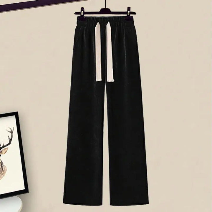 Stylish women's fall fashion: knit sweater and wide-leg pants set for casual wear.