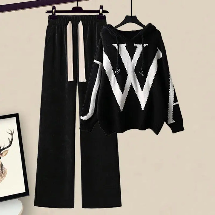 Close-up of the soft knit fabric on women's elegant sweater and wide-leg pants set.