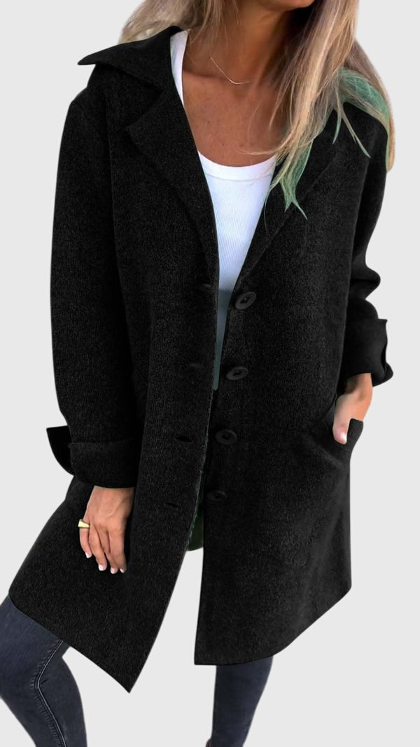 Professional woman wearing a stylish longline blazer, perfect for modern workwear & office fashion.