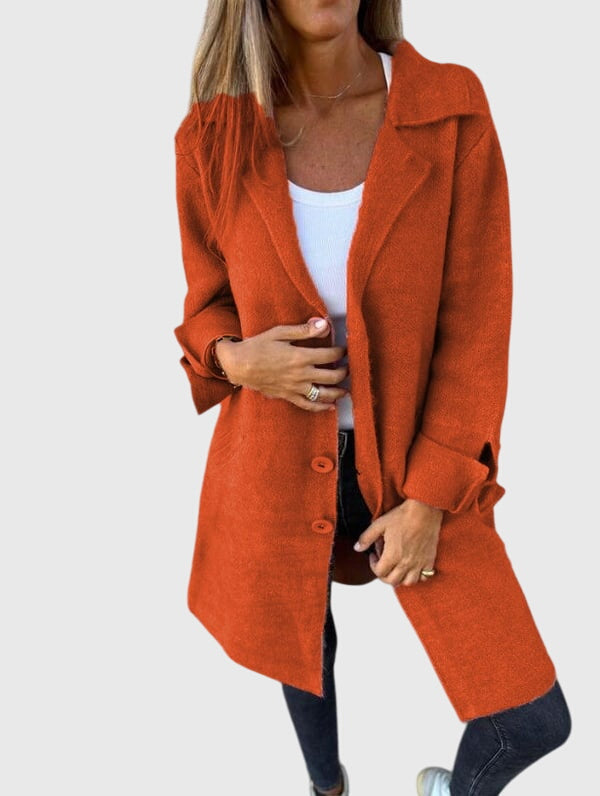 Single-breasted longline blazer, closed, showing a sleek, tailored look for work or smart casual events.