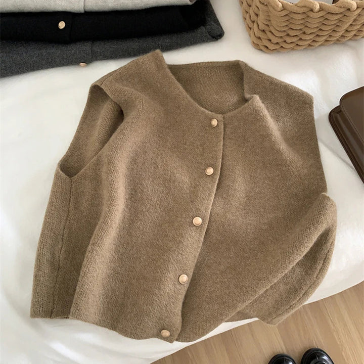 Elegant sleeveless merino knit vest, perfect for layering in fall fashion.