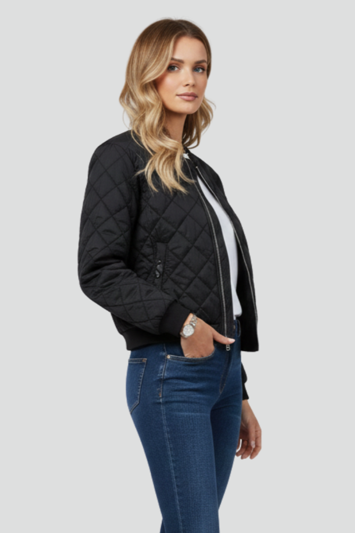 Women's comfortable quilted zip jacket with relaxed fit. Versatile casual outerwear for fall, spring, & everyday wear.