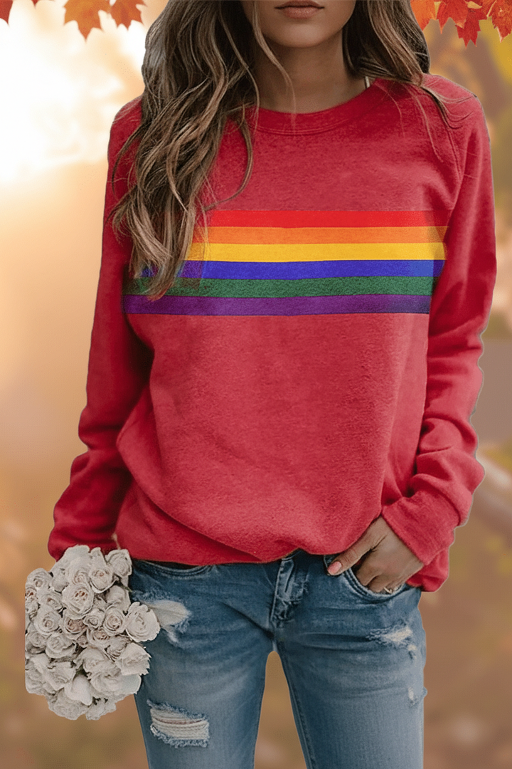 Women's cozy rainbow striped sweatshirt, perfect for everyday casual wear. Soft long-sleeve pullover with relaxed fit.