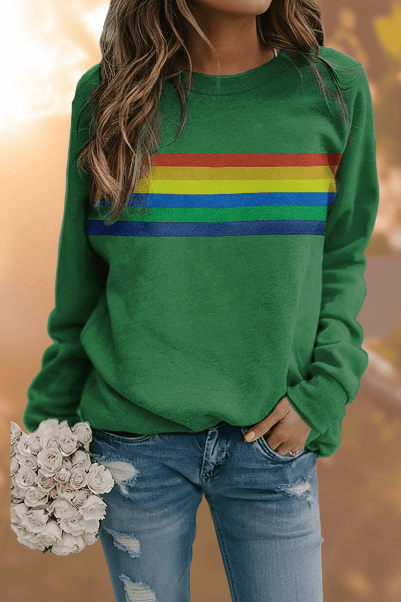 Women's long-sleeve cozy sweatshirt with playful rainbow stripes. Relaxed fit pullover, perfect casual apparel.