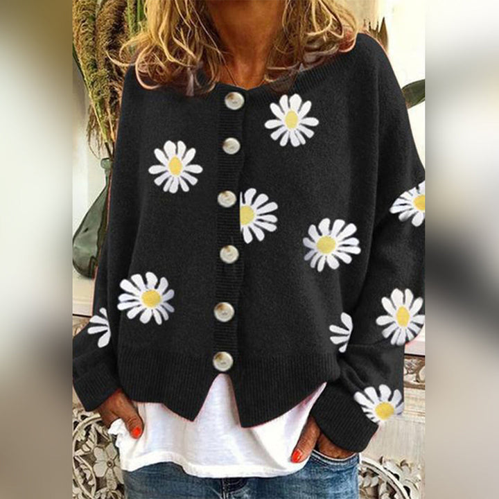 Close-up of a women's winter cardigan showcasing its floral button-up detail and cozy texture