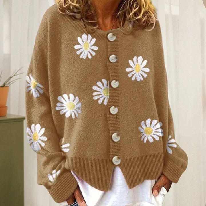 Front view of a women's cozy winter cardigan, buttoned up, with an all-over floral pattern