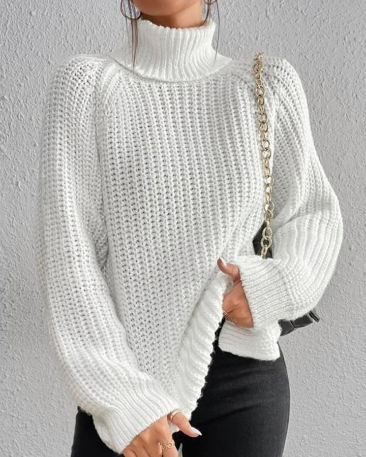 Women's cozy ribbed knit winter sweater in a warm, neutral tone, perfect for fall fashion.