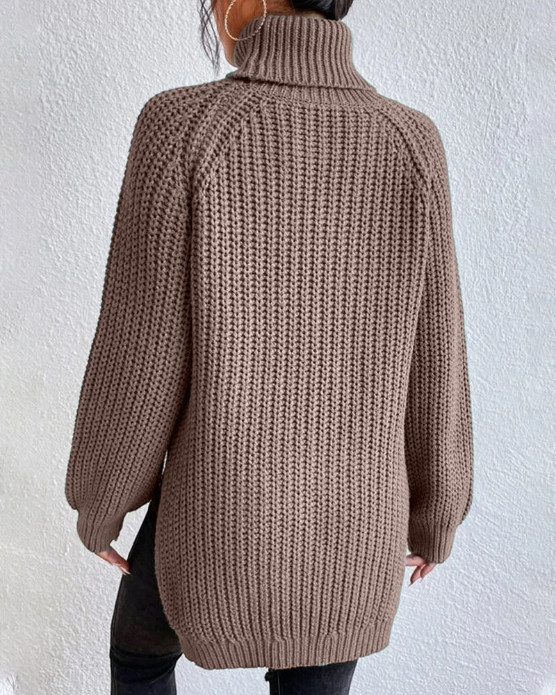 Lifestyle image of a woman enjoying a cozy day in a ribbed knit winter sweater, perfect for lounging.