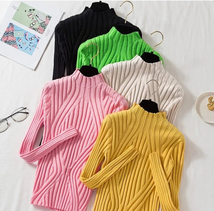Effortless warmth & style in this women's roll neck long sleeve top. Autumn/winter wardrobe essential.