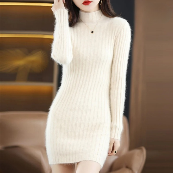 Elegant women's roll neck knitted dress. Warm, long sleeve, above knee for stylish autumn/winter fashion.