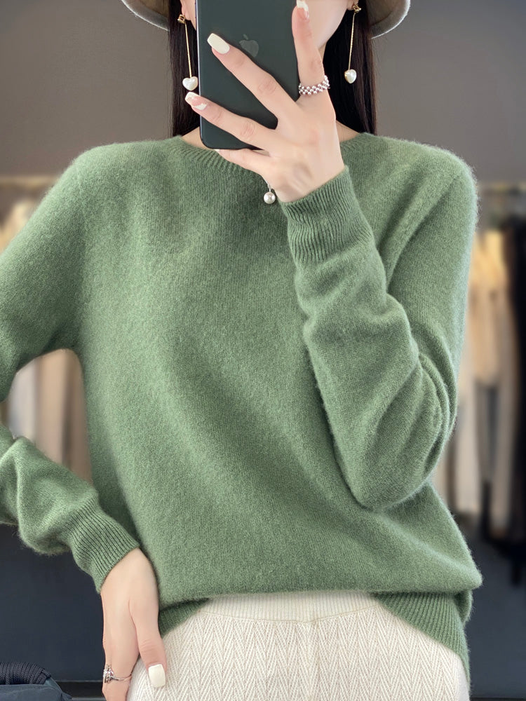 Women's cozy round neck pullover sweater with a relaxed fit and long sleeves.