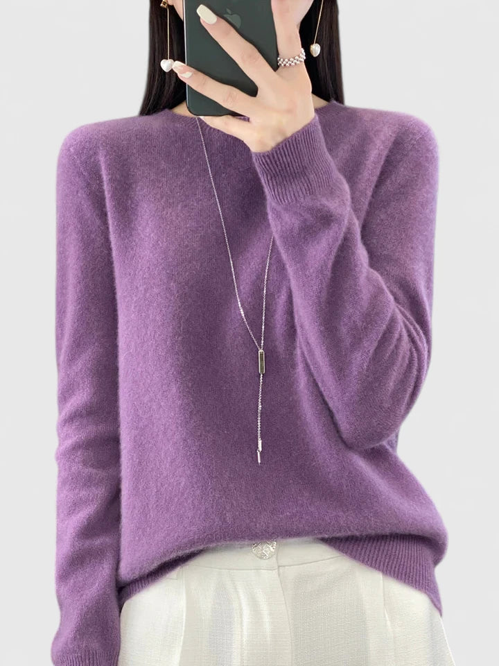 Relaxed fit women's long sleeve round neck pullover, ultra-cozy for cold weather.
