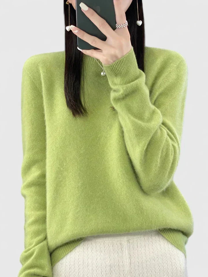 Modern women's cozy round neck pullover sweater, fall and winter fashion staple.
