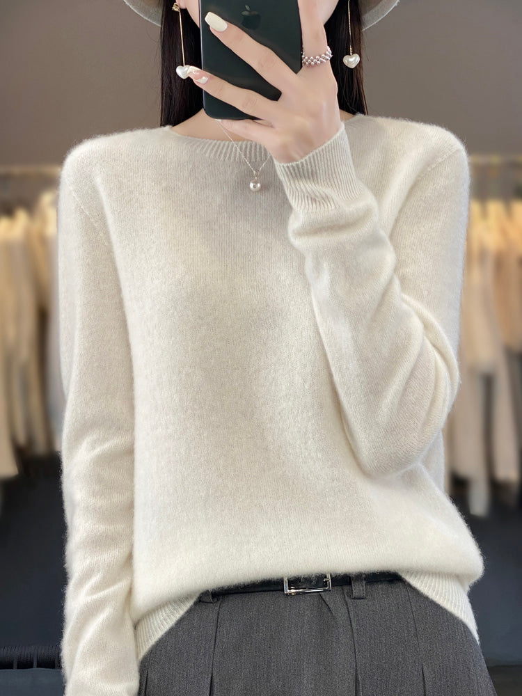 Detail shot: Cozy knit texture of women's round neck pullover, long sleeve.