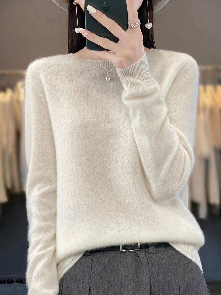 Detail shot: Cozy knit texture of women's round neck pullover, long sleeve.