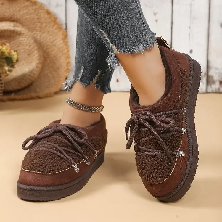 Stylish women's warm footwear, lace-up boots with a visible cozy sherpa fleece lining