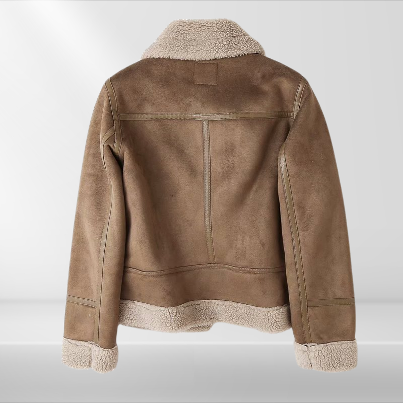 Stylish women's zip bomber jacket in soft sherpa fleece, offering cozy warmth for casual fall and winter outfits.