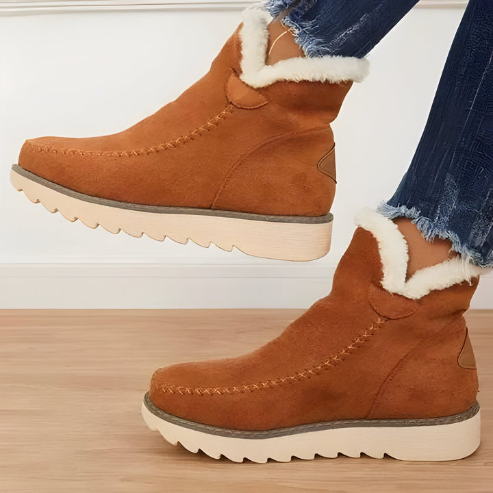Cozy women's slip-on booties, ideal for winter. Warm, comfortable, and stylish casual everyday footwear.
