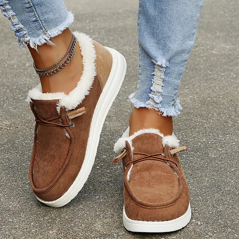 Cozy women's flat winter shoes, easy slip-on design, providing warmth and non-slip security.