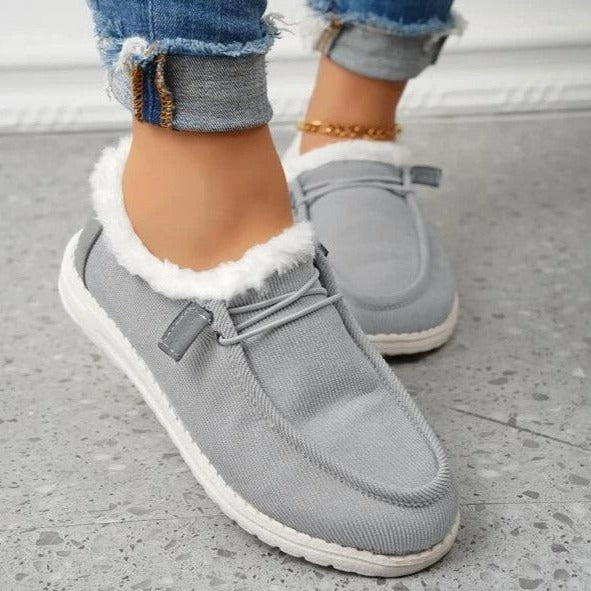 Plush-lined women's slip-on winter shoes, offering warmth, comfort, and a non-slip grip.