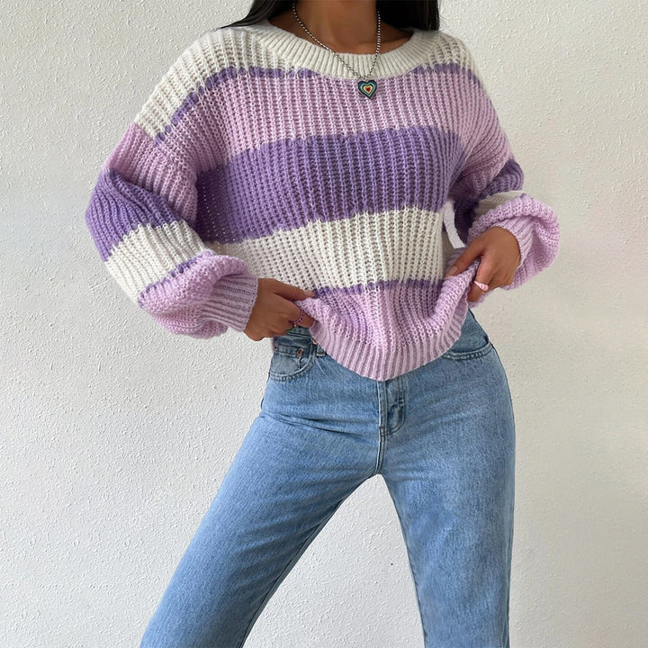 Women's cozy striped knit pullover sweater in cream and black, perfect for fall and winter fashion.