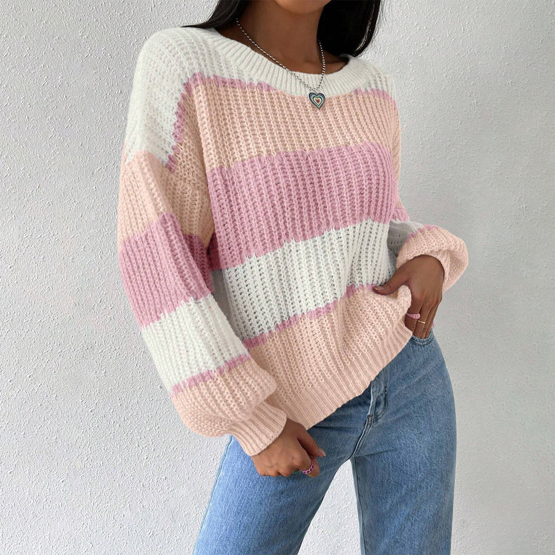 Stylish women's striped knit pullover sweater with long sleeves, ideal for a casual winter outfit.