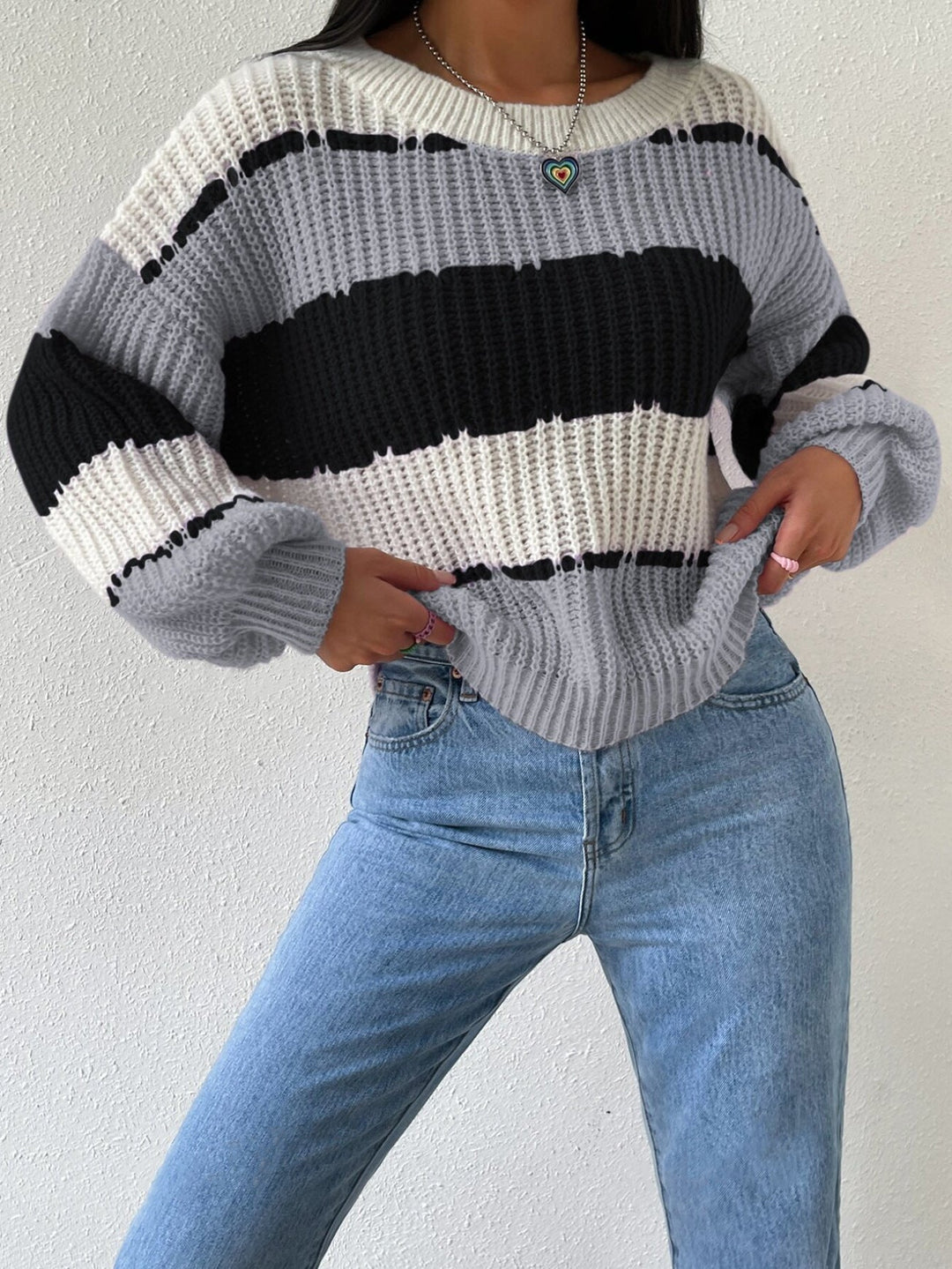 Versatile women's striped knit pullover sweater in a classic design, suitable for everyday wear.