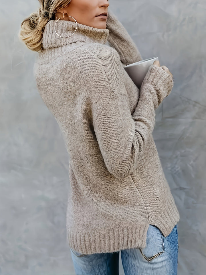 Everyday women's turtleneck sweater with relaxed fit and fashionable split hem.