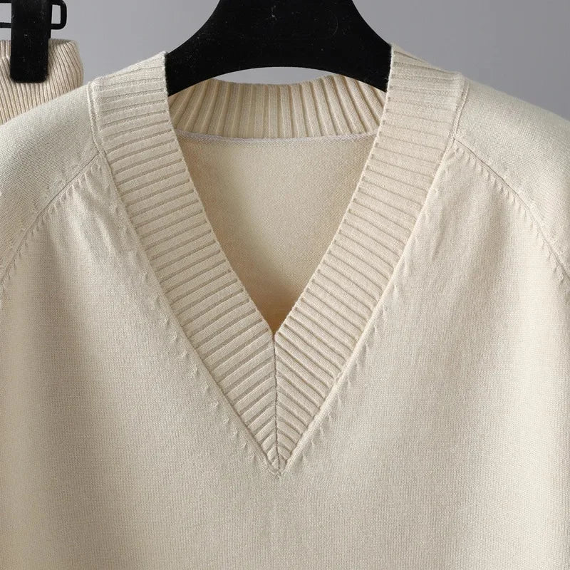 Stylish women's knit loungewear set featuring a cozy V-neck sweater and comfortable matching trousers.