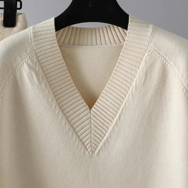Stylish women's knit loungewear set featuring a cozy V-neck sweater and comfortable matching trousers.