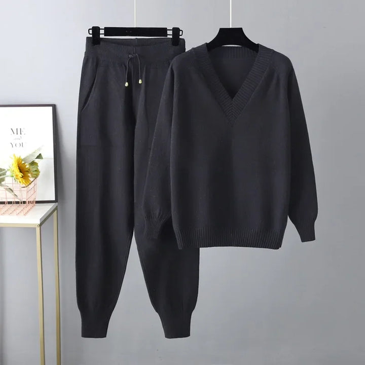 Casual chic women's V-neck knit sweater and trouser set. Soft texture, perfect for cozy comfort.