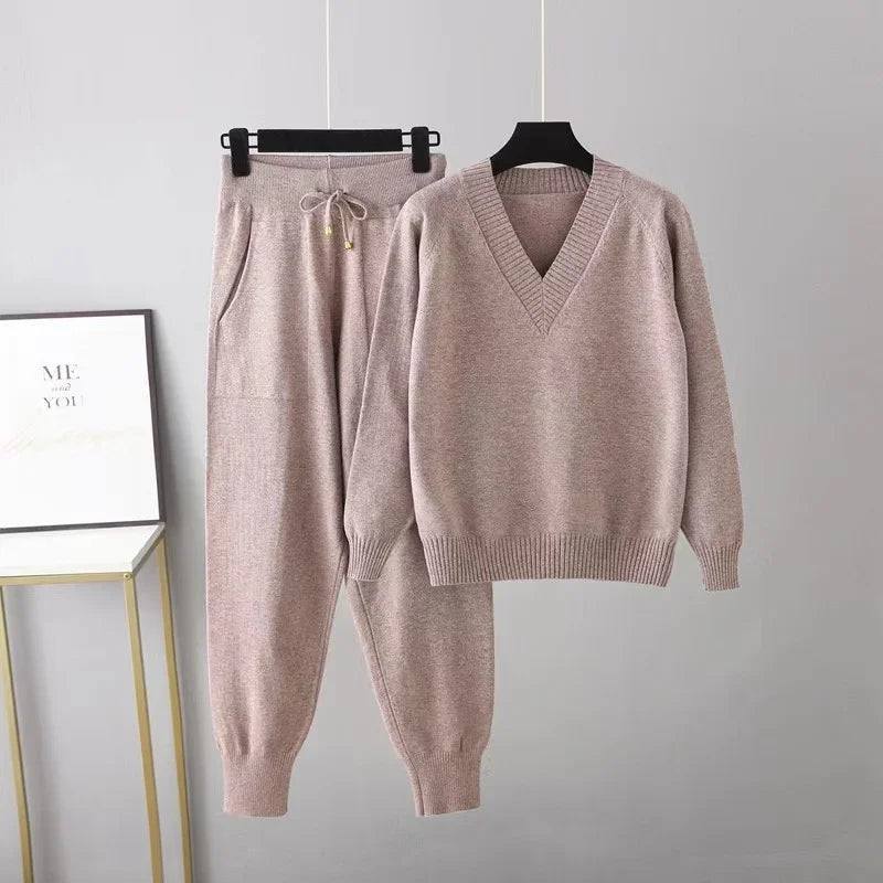 Versatile women's two-piece knit set: V-neck pullover & trousers. Combines comfort with elegant style.