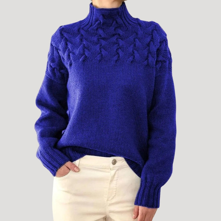 Stylish women's cable knit high-neck sweater in a solid color, perfect for spring fashion