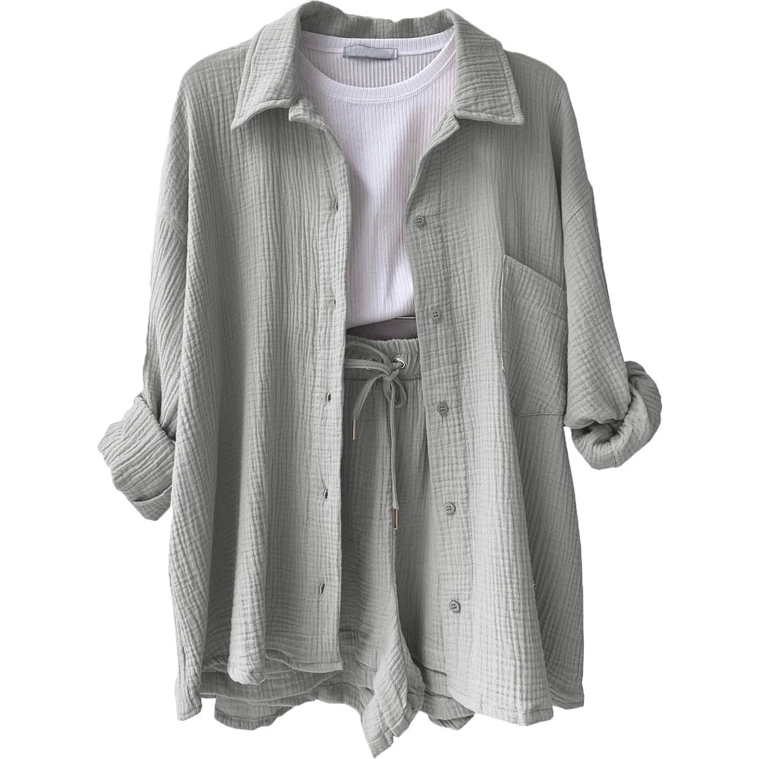 Model smiling while wearing a light and airy crinkle lounge set in cream, ideal for a warm summer day.