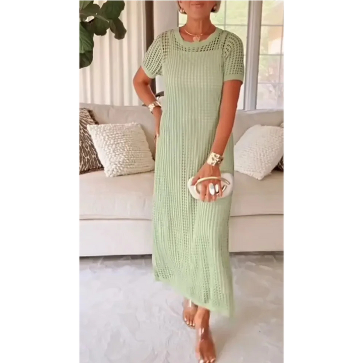 Resort chic women's maxi dress, crochet open weave design, flowy and stylish for vacation.